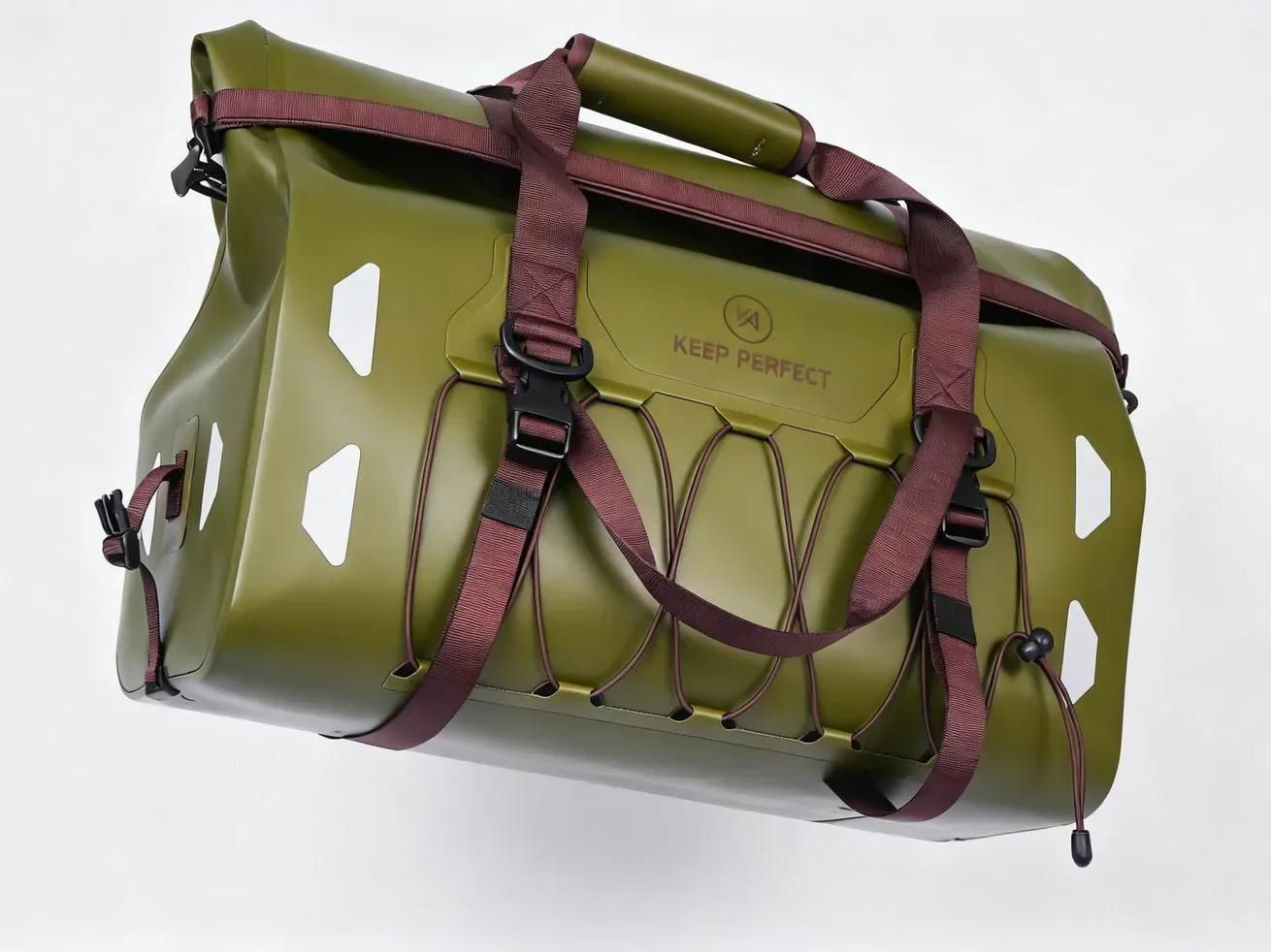 Close-up of an insulated cooler bag lid showing a #8 polyester coil zipper under a foam-filled zipper flap, with the webbing handle loop continuing under the top panel and bar-tacked at two points